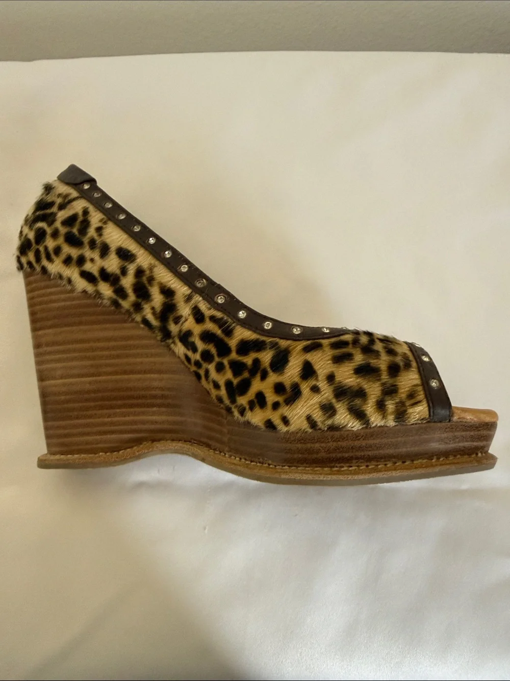 Animal print wedges with rhinestone trim. Leather upper size 8.